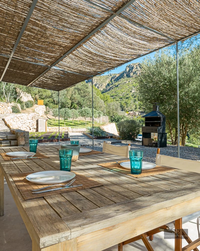 Modern exterior with reflective pool. Clean architecture, ambient lighting, and landscaped grounds. Ideal for relaxation and entertaining.