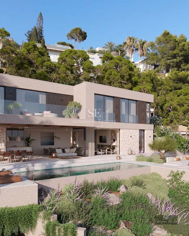 Spacious pool surrounded by lush greenery. Modern design with sun loungers and umbrellas. Ideal for relaxation and entertainment.