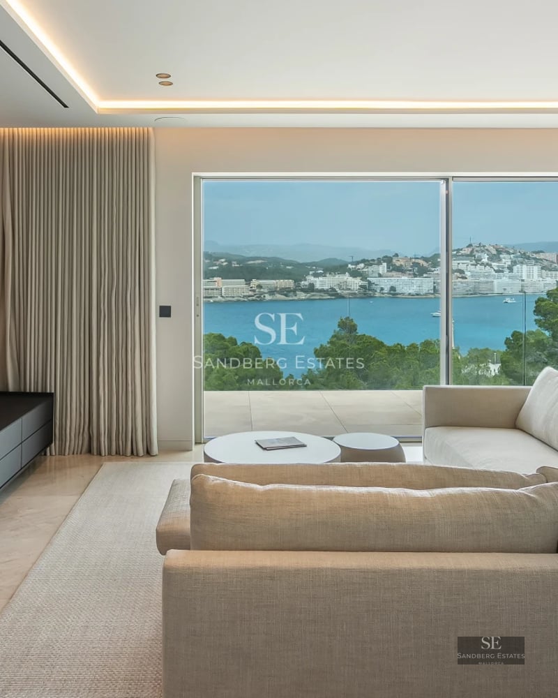 Modern exterior with infinity pool, spacious terraces, designer furniture, and lush greenery. Panoramic views.