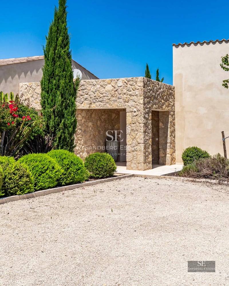 View of a modern pool surrounded by lush greenery and elegant architecture. Minimalist design with ambient lighting.