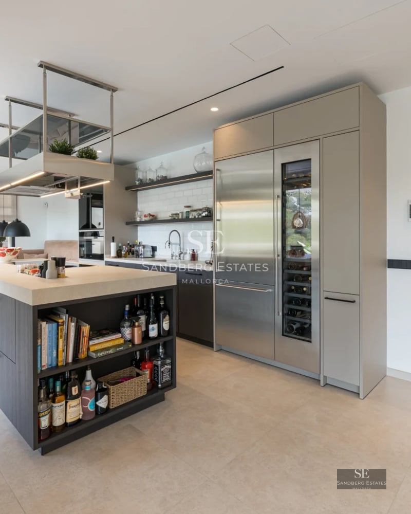 Image of a luxurious property with an infinity pool and panoramic views. Modern design with spacious terraces and lush gardens.