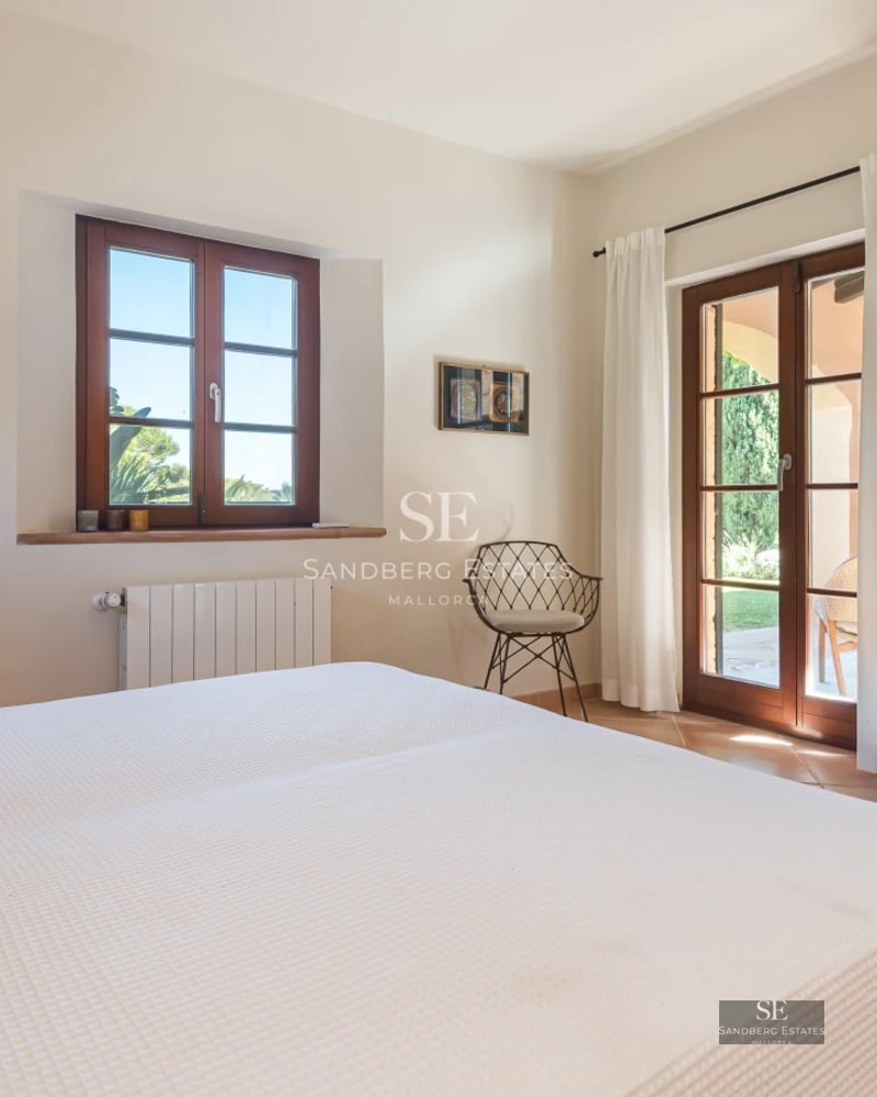 Exterior view of a modern villa with a pool, garden, and large windows. Minimalist architecture and elegant design.