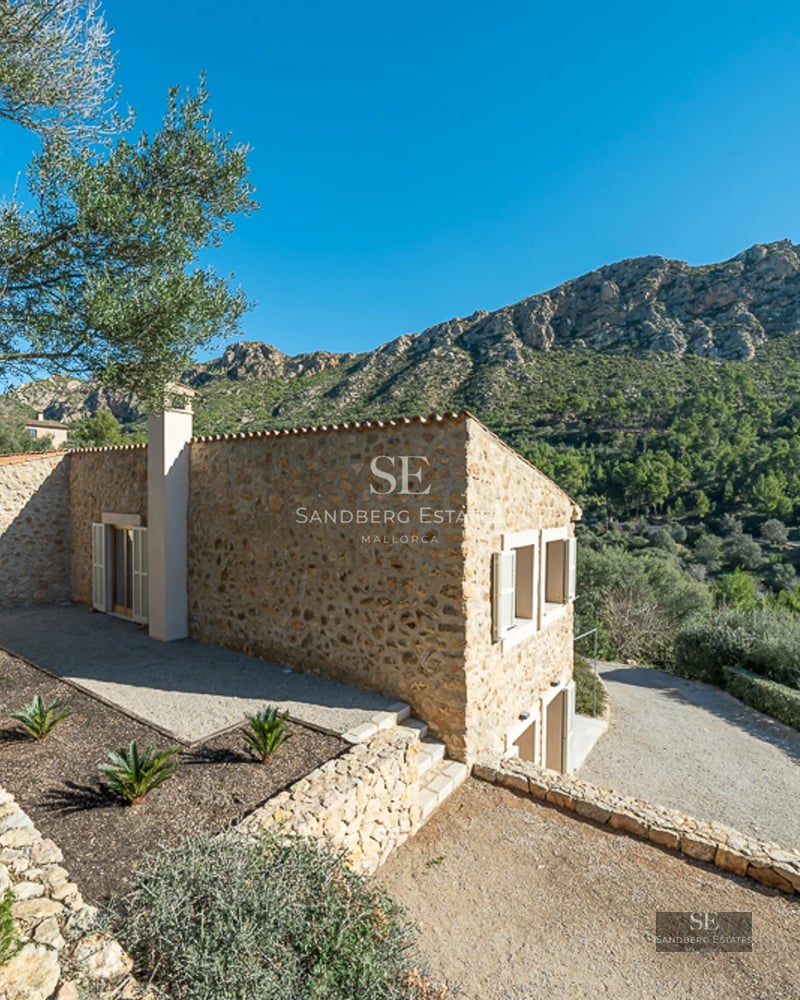 Exterior view of modern villa with infinity pool, manicured garden, and expansive terraces. Minimalist architecture and natural light.