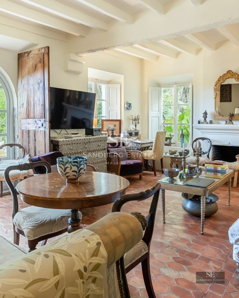 Panoramic view of infinity pool, surrounded by greenery. Modern design with warm lighting and unobstructed views.