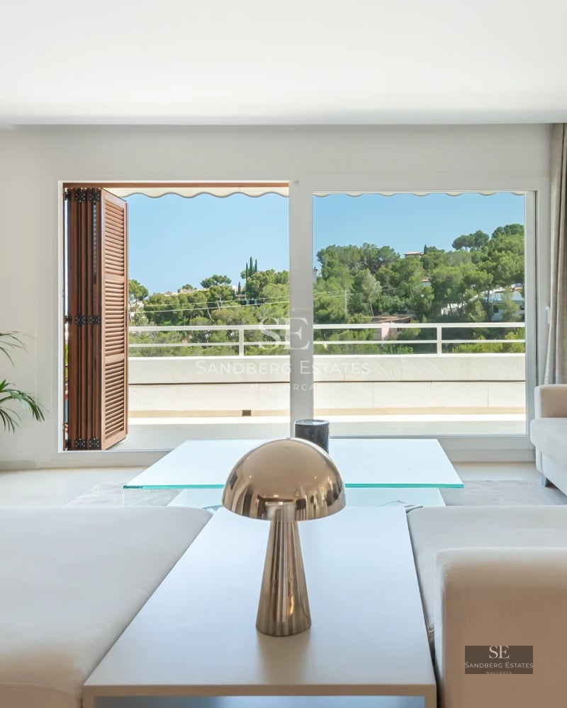 Exterior view of a modern villa with an infinity pool, expansive terraces, and lush gardens. Minimalist architecture with large windows.