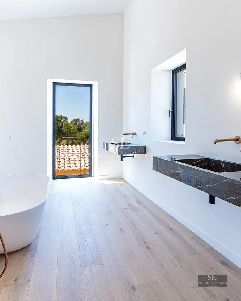 Spacious living room with picture windows, modern fireplace, designer furniture, and unobstructed views. Abundant natural light.