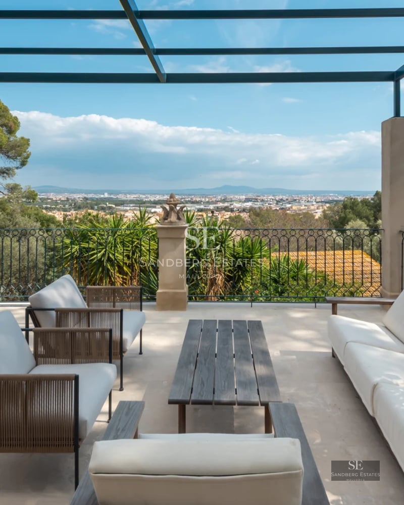 View of an infinity pool surrounded by lush greenery and modern architecture. Minimalist and elegant design with soft lighting.