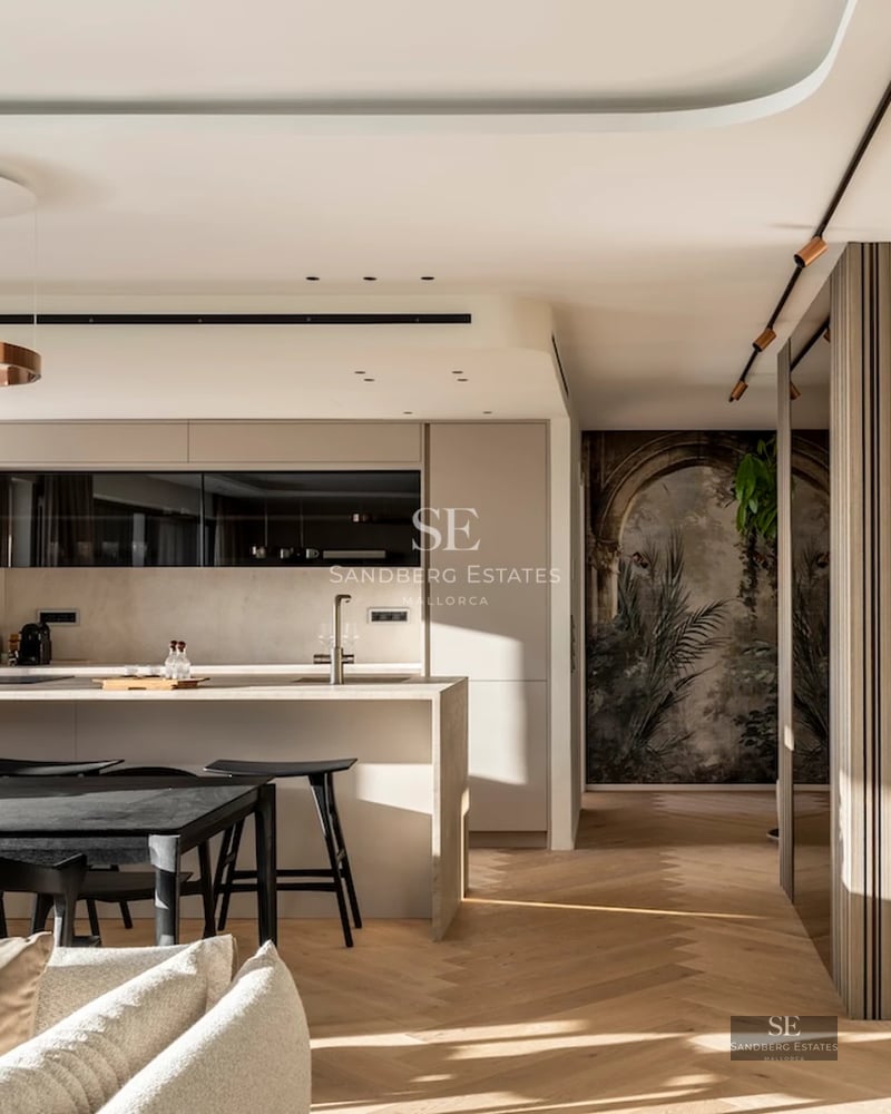 Exterior view of a modern villa featuring a reflecting pool, lush garden, and minimalist architecture. Large windows and abundant natural light.