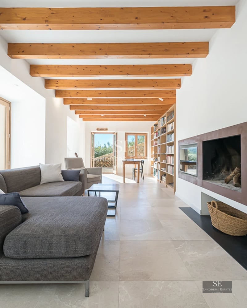 Expansive terrace with an infinity pool. Modern design featuring sun loungers, ocean views, and minimalist architecture.