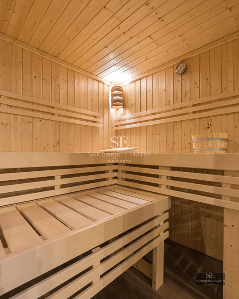 Spacious living room with large windows, outdoor pool, and modern furniture. Natural lighting and unobstructed views.