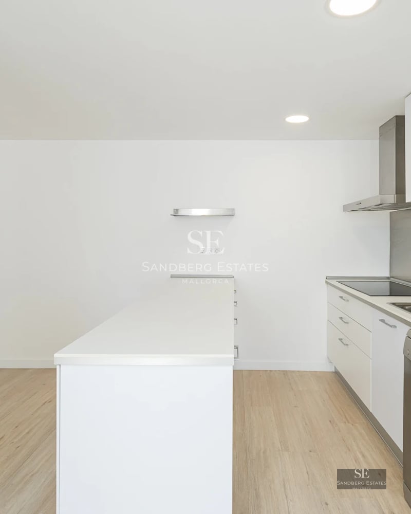 Modern facade with pool. Large windows, natural stone, minimalist landscaping, and a bright blue swimming pool.