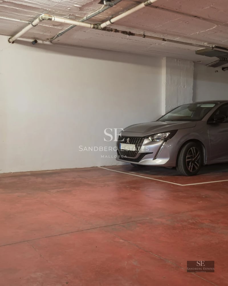 Exterior view of a modern villa featuring an infinity pool, manicured garden, and spacious terraces. Minimalist architectural design.
