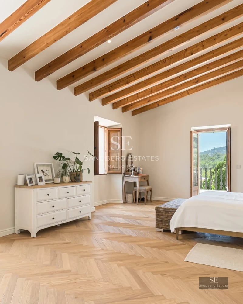 Bright living room featuring floor-to-ceiling windows with sea view. Leather sofa, modern coffee table, designer rug. Warm lighting, luxury finishes.