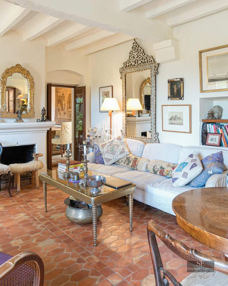 Panoramic view of a modern villa with infinity pool. Stone details, large windows, and minimalist design.