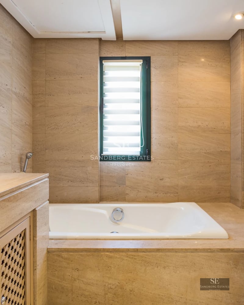 Expansive terrace with infinity pool, sun loungers, and panoramic views. Modern design with clean lines and natural materials.