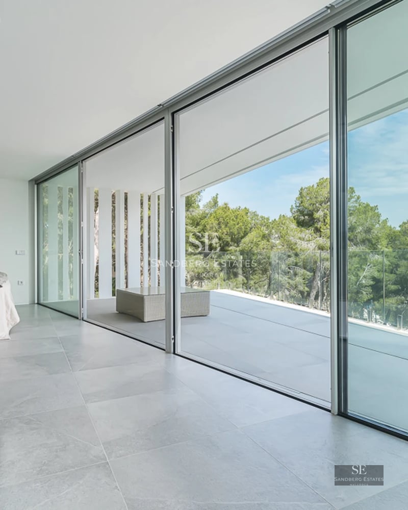 Spacious terrace with swimming pool, garden, and modern furniture. Contemporary architecture with windows maximizing natural light.