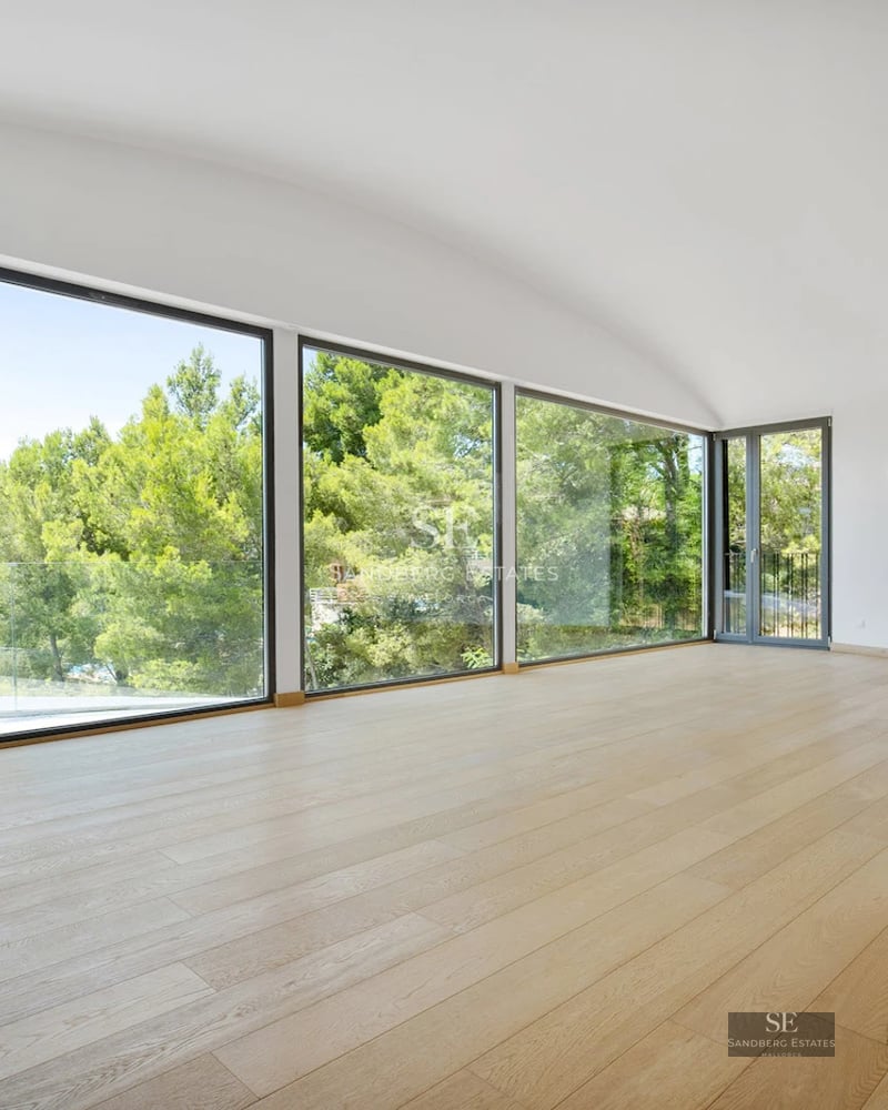 Exterior view of a modern villa with pool, terraces, and lush garden. Sleek design and expansive green spaces.