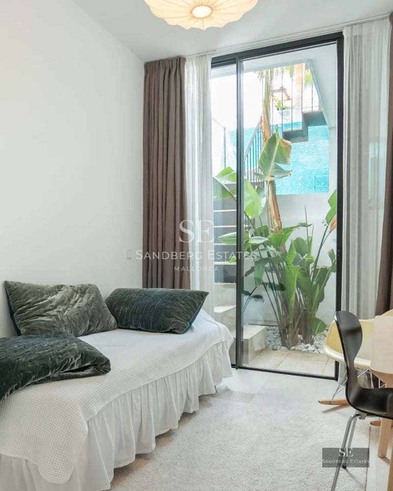 Exterior view of a modern villa with a pool, manicured garden and minimalist architecture. Soft lighting and predominantly neutral tones.