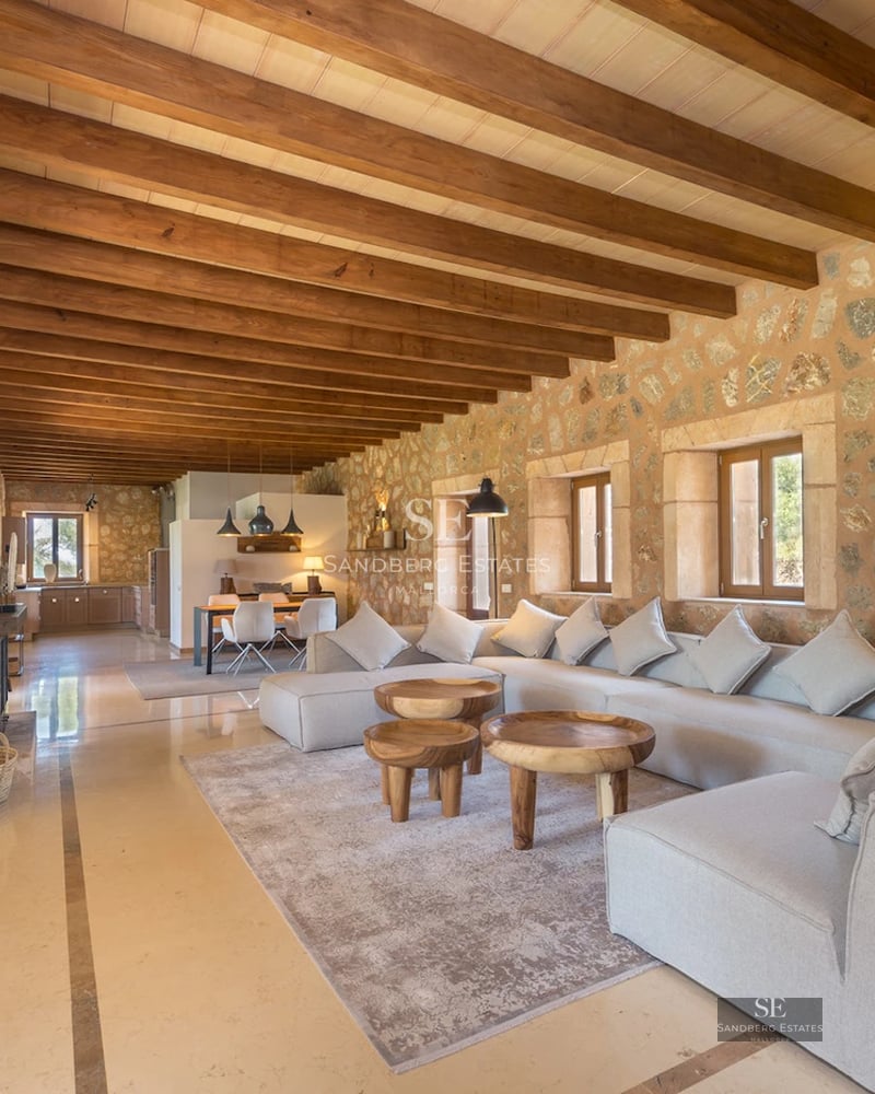 Expansive terrace featuring an infinity pool, sun loungers, and panoramic views. Modern, minimalist design with touches of greenery.