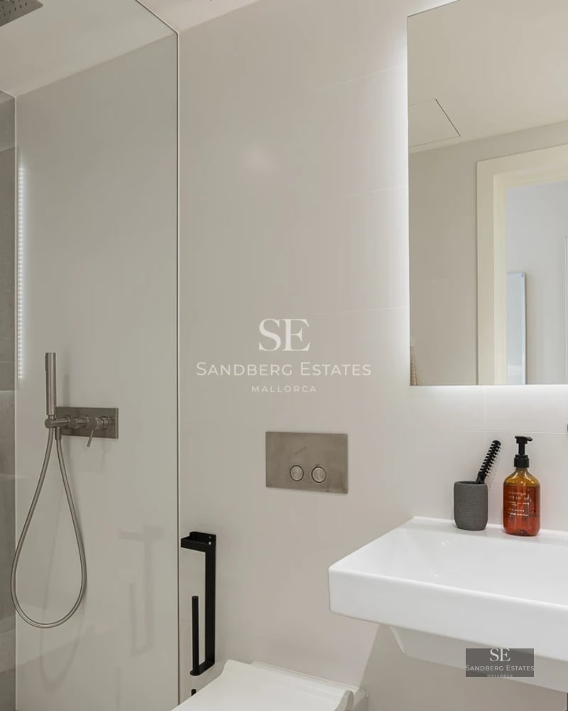 Pool and modern house view featuring large windows, minimalist architecture, and lush greenery.