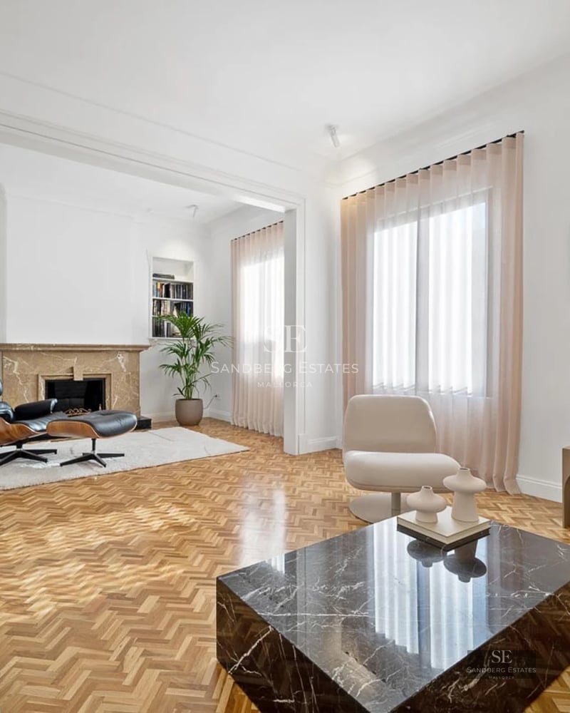 Exterior view of a modern villa with a pool, well-maintained garden, minimalist design, and large glass windows maximizing natural light.