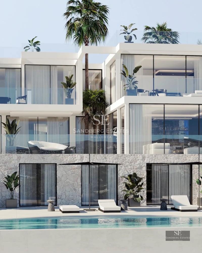 View of infinity pool, sun loungers, and modern house in the background. Sleek design with abundant natural light and neutral color palette.