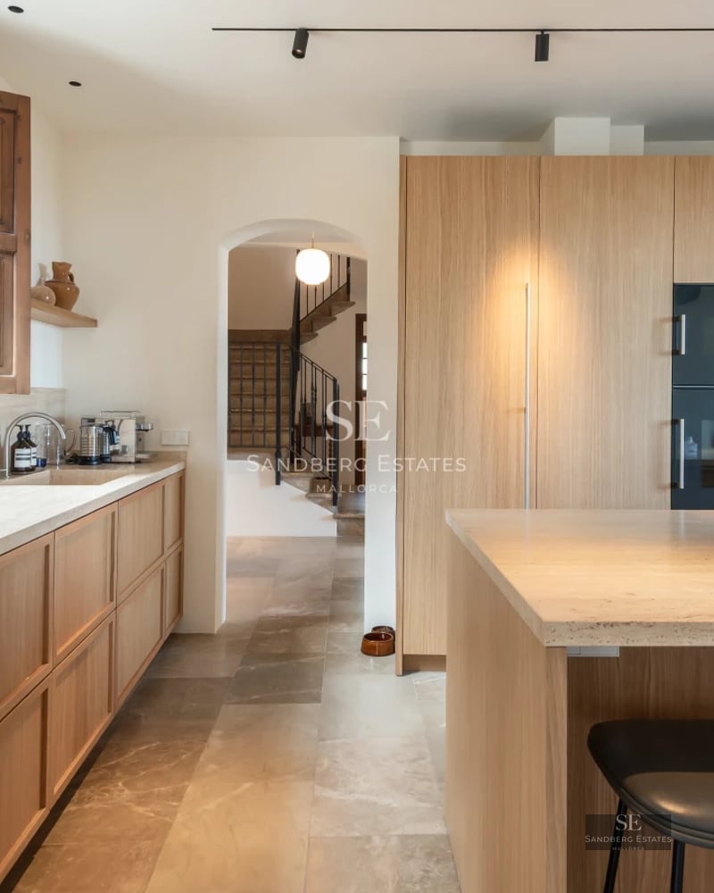 Exterior view of a modern villa with pool, large garden, and sleek architectural design. Abundant natural lighting.