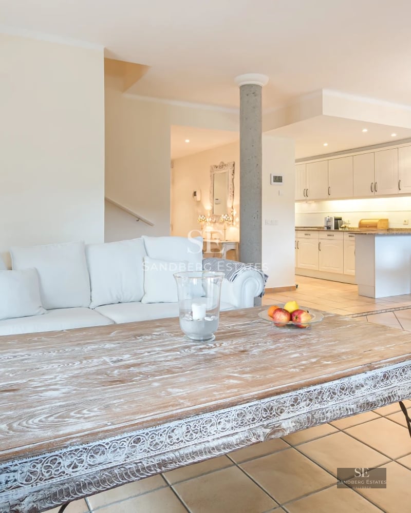 Expansive terrace with pool, sun loungers, and panoramic views. Modern design, luxurious finishes, and relaxing ambiance.