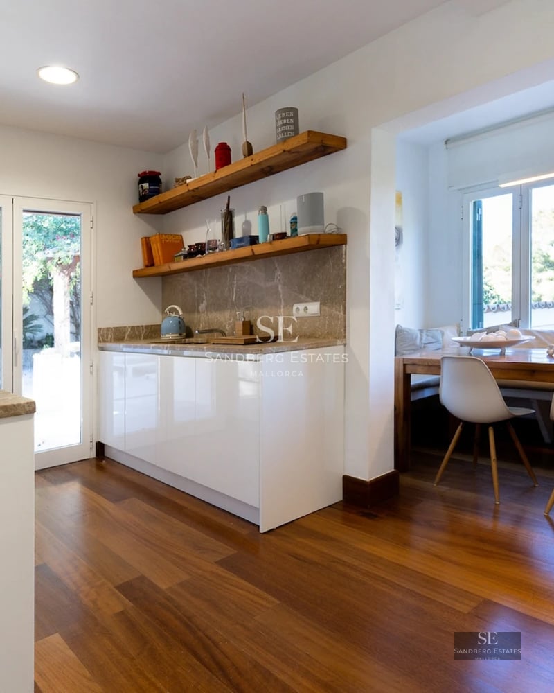 Spacious terrace with infinity pool, sun loungers and panoramic views. Modern design with clean lines and natural materials.