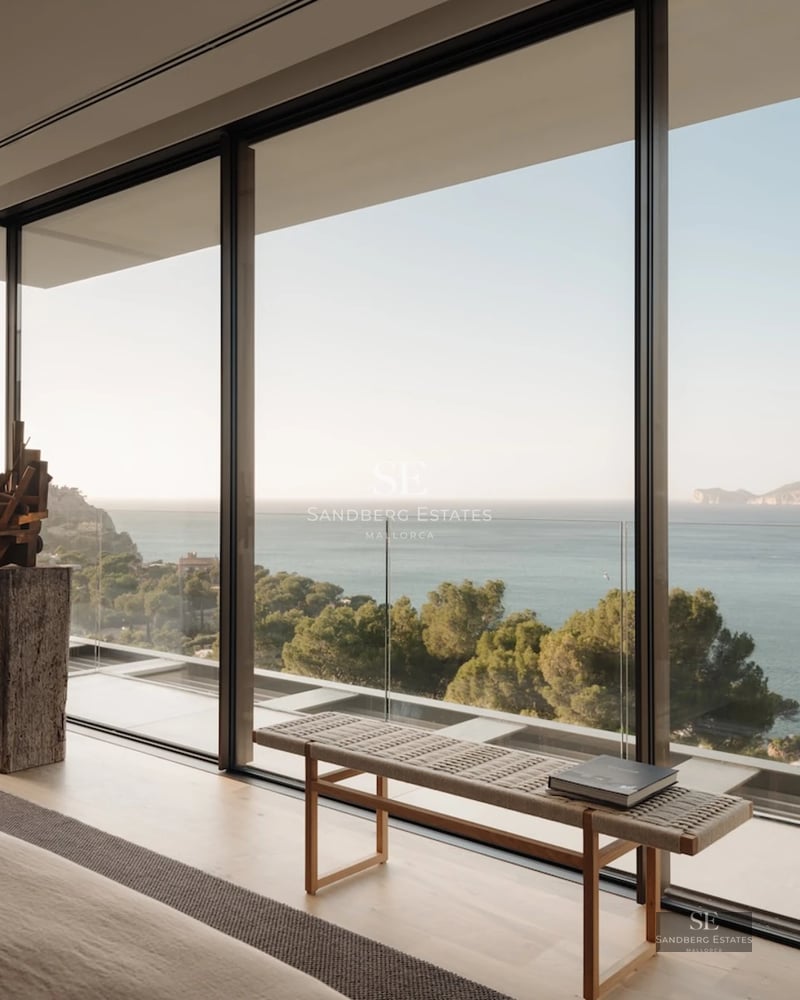 Expansive terrace with infinity pool and sea views. Modern, minimalist design, elegant and relaxing outdoor furniture.