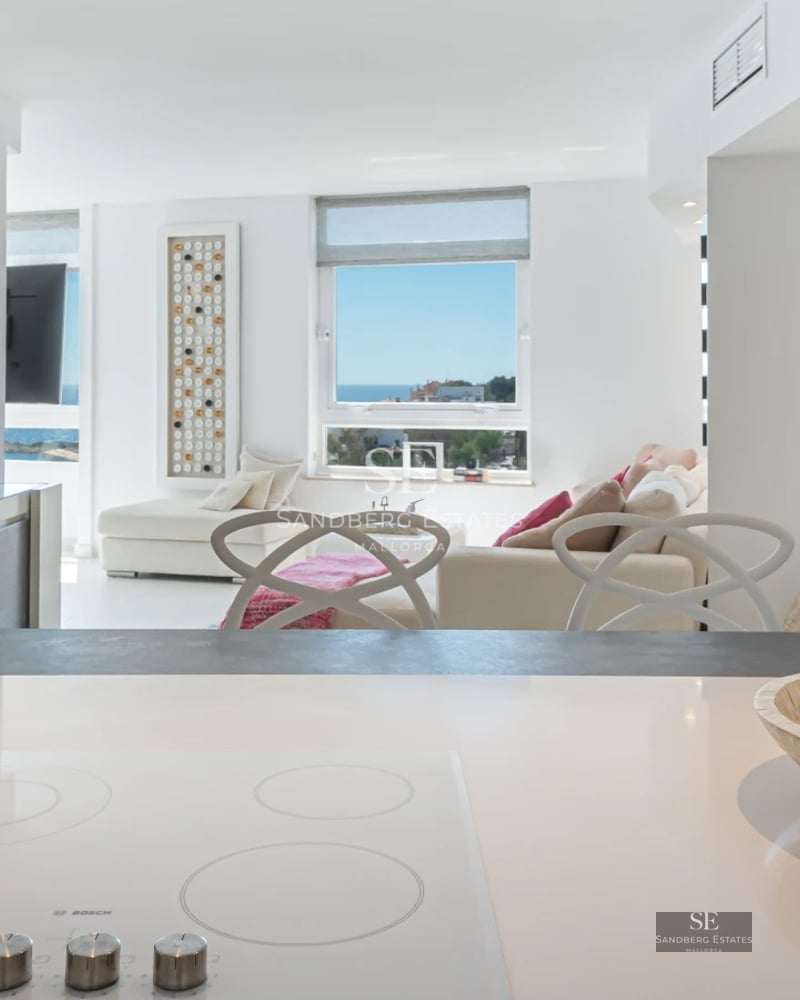 Contemporary design villa featuring an infinity pool, spacious terraces, lush vegetation, and panoramic sea views.