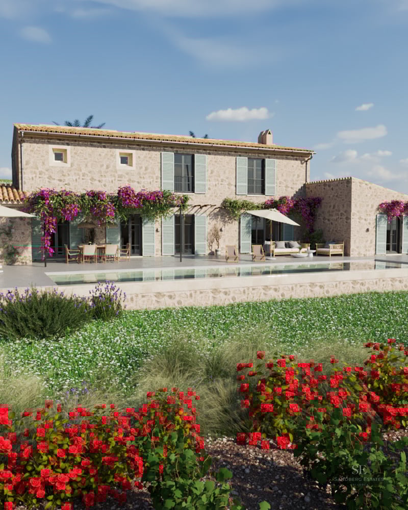 Stone villa featuring a long swimming pool, purple bougainvillea, red roses, and outdoor lounge furniture under a clear sky.