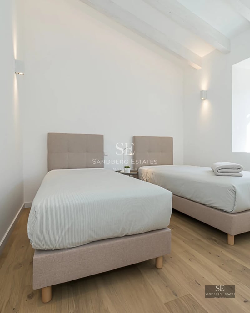 Exterior view of a modern villa with a pool, garden, and terraces. Sleek design with large windows and manicured landscaping.