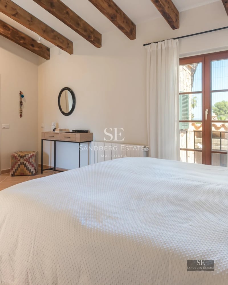 Spacious terrace with infinity pool, sun loungers, and panoramic sea views. Modern and minimalist design.