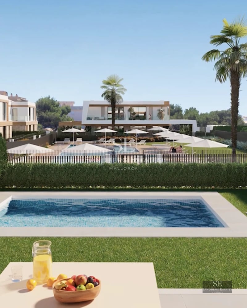 Large terrace with pool, sun loungers, and garden view. Modern design with ambient lighting.