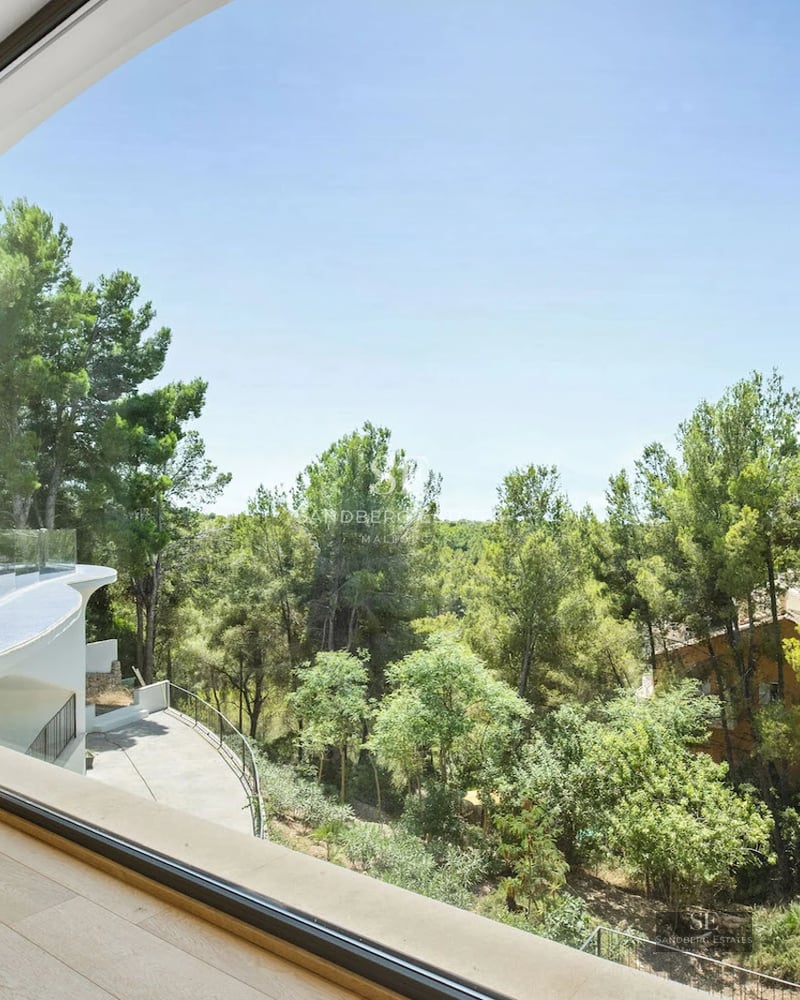 Modern exterior with infinity pool, spacious terraces, and panoramic sea views. Minimalist design featuring large windows.