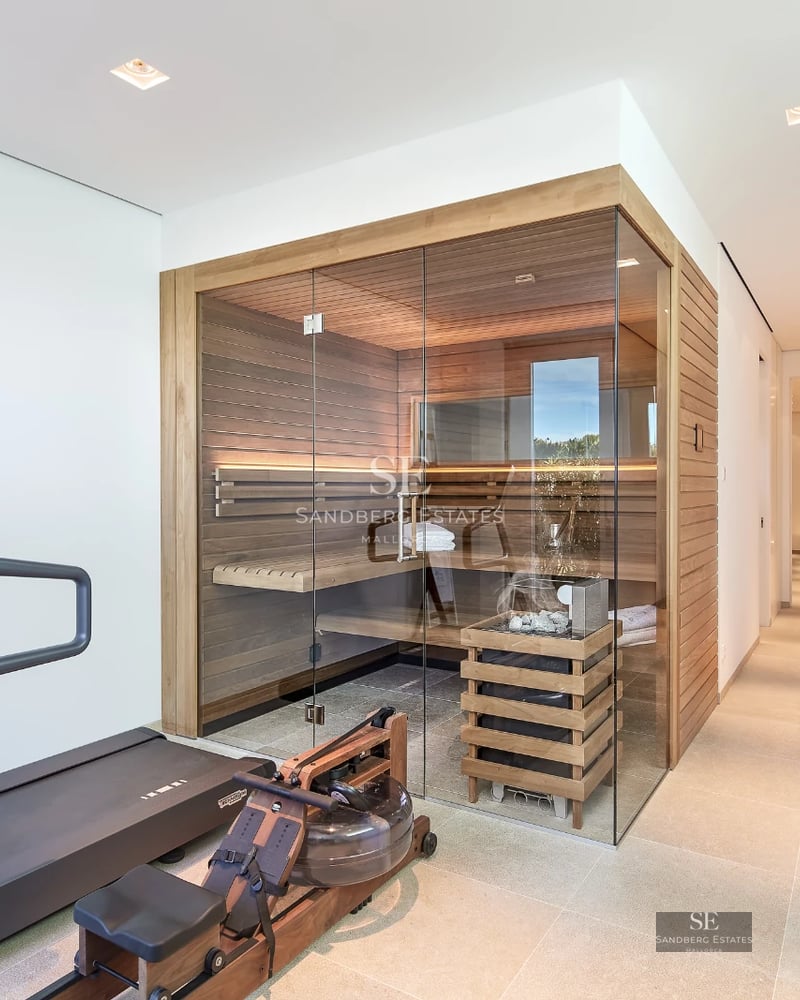 Image of a modern infinity pool with panoramic sea views. Minimalist architecture, light colors, surrounded by greenery.