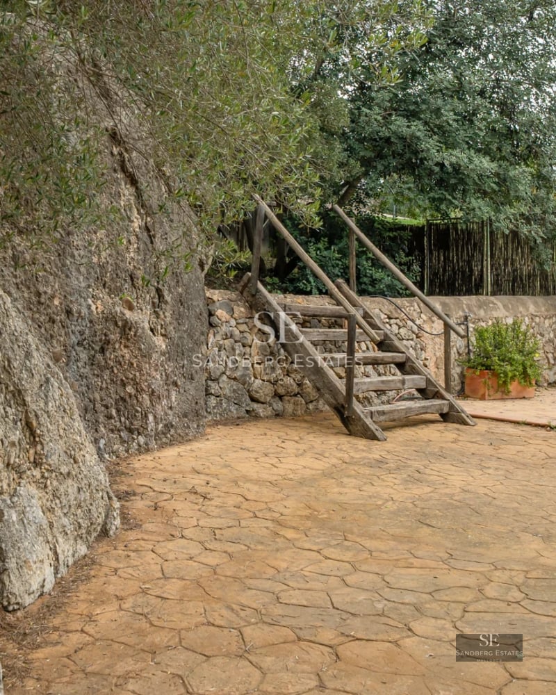 Bright interior with balcony, modern furniture, and elegant design details. Large windows offer panoramic views.