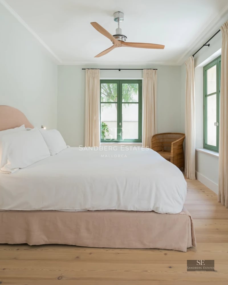 Exterior view of modern villa with infinity pool, spacious terraces, lush garden, and contemporary architecture.