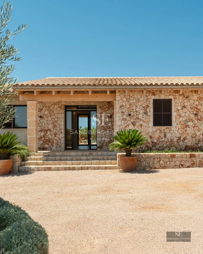 Large pool surrounded by lush greenery, with modern villa in the background. Minimalist architectural design and luxurious finishes.