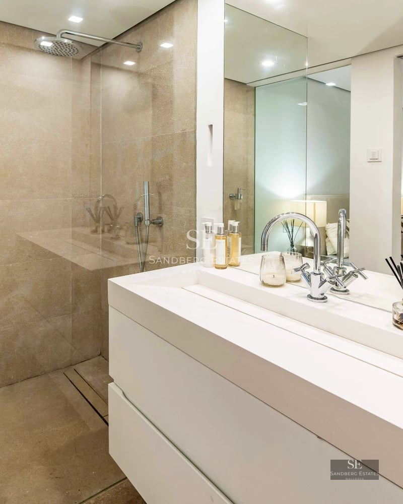 Spacious terrace with infinity pool, sun loungers, and panoramic views. Modern design featuring clean lines and high-end materials.