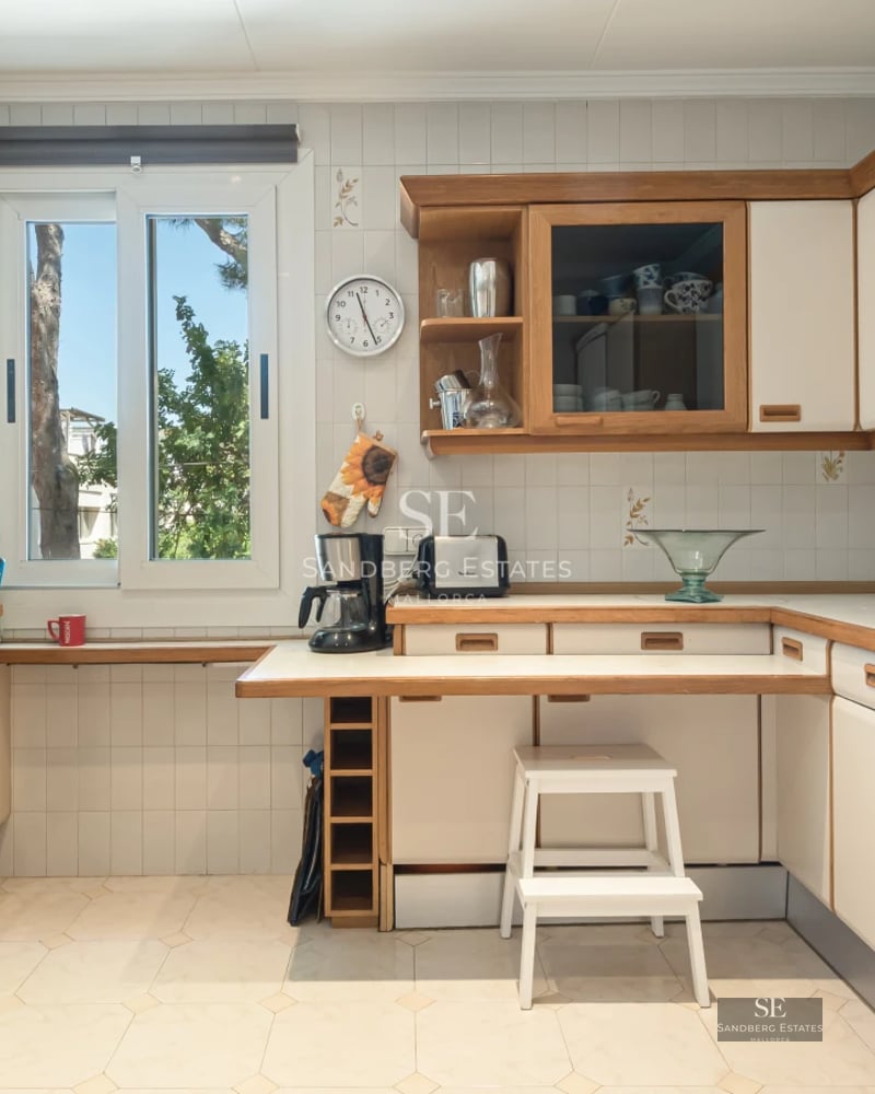 Exterior of modern villa with infinity pool, sun loungers, and panoramic sea view. Minimalist design with large windows.