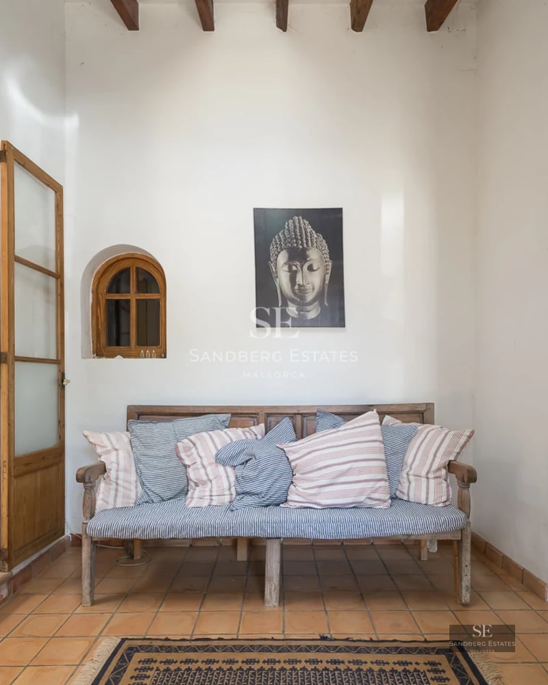 Exterior view of a modern villa with pool, lounge chairs, and large garden. Minimalist architecture and manicured landscaping.