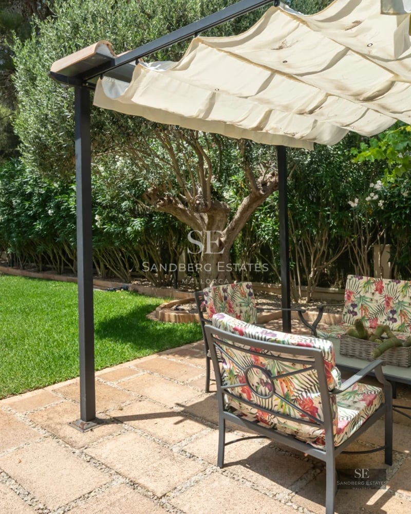 Exterior of a modern home with infinity pool, lush garden, and expansive terraces. Minimalist architecture.