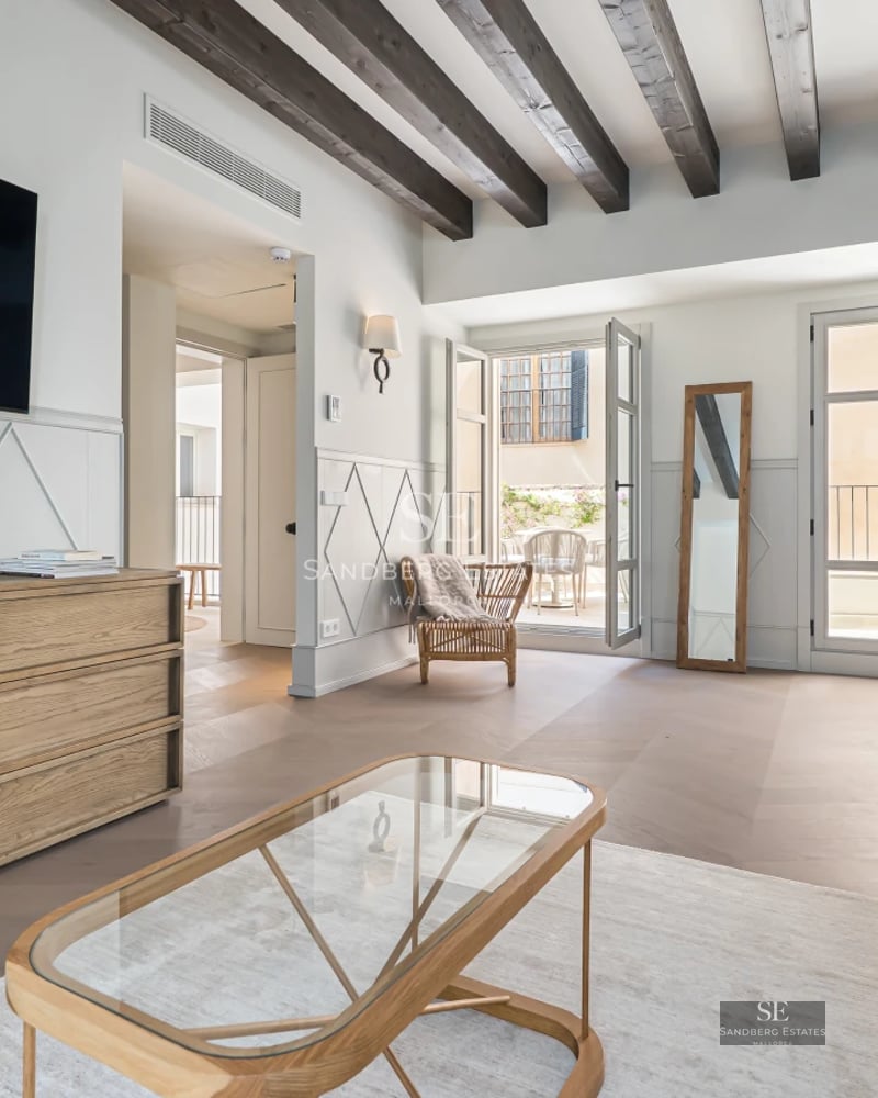 Expansive terrace with infinity pool, lounge chairs, and panoramic views. Modern design with high-quality materials.