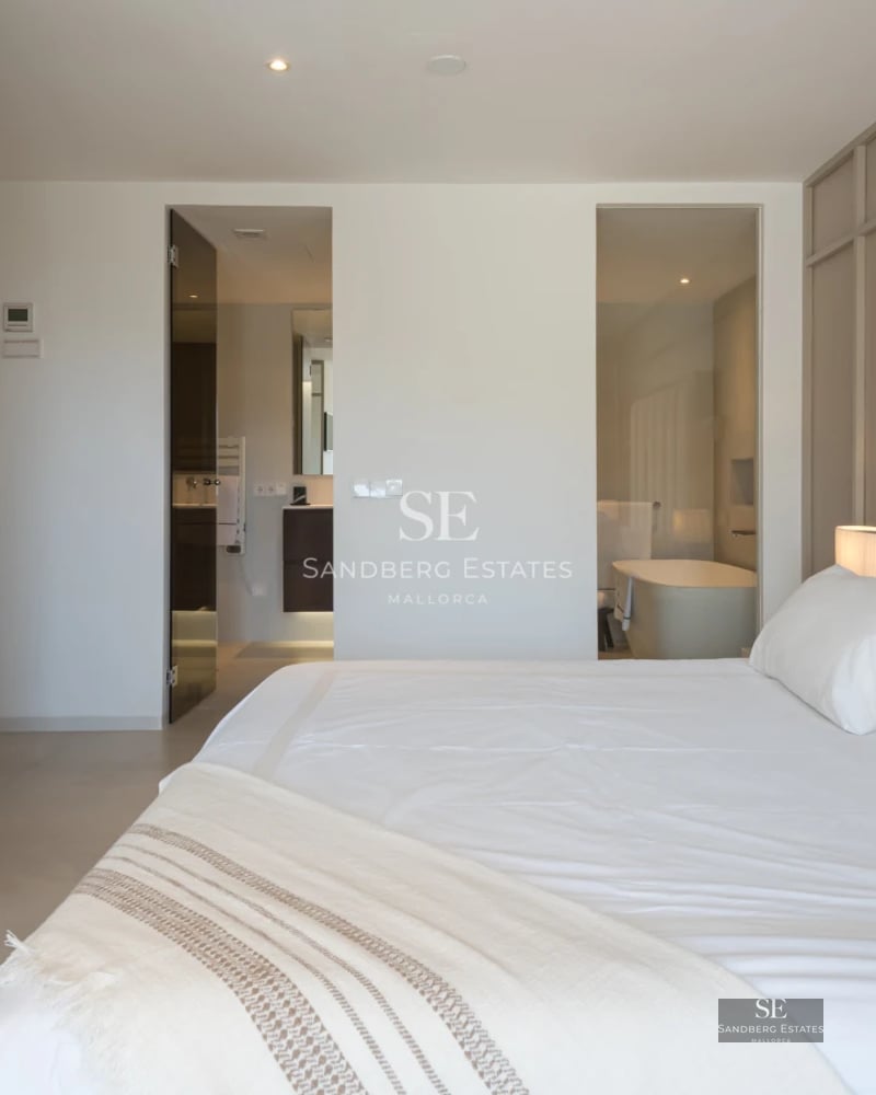 Exterior view of a modern villa with reflecting pool, expansive terraces, and lush greenery. Minimalist architecture, elegant design.