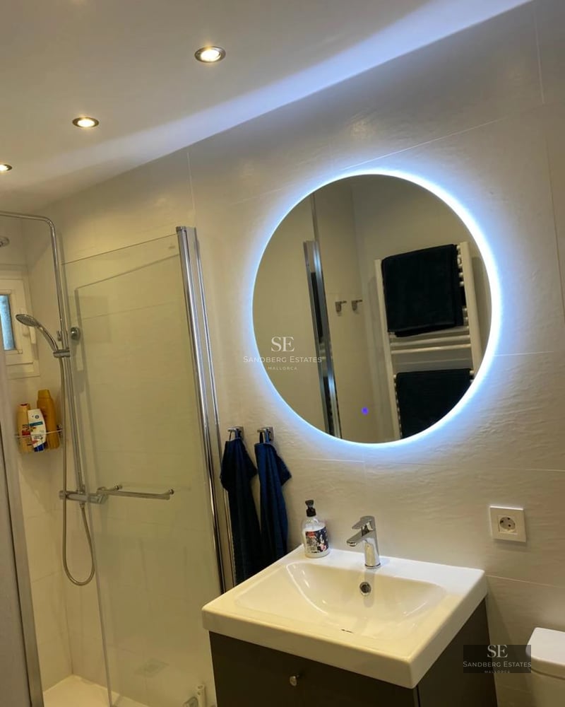 Exterior of a modern villa featuring a pool, large windows, and lush garden. Contemporary architecture and landscaping.