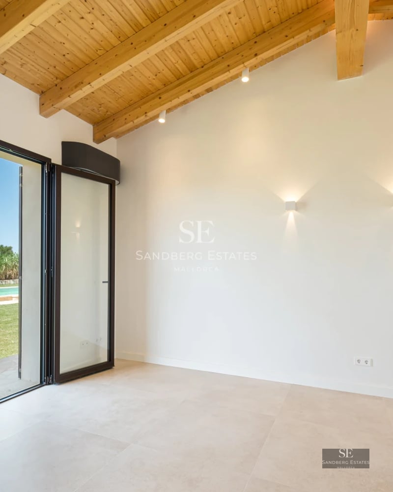 Expansive terrace with modern pool, sun loungers, and lush greenery views. Minimalist design with natural light.