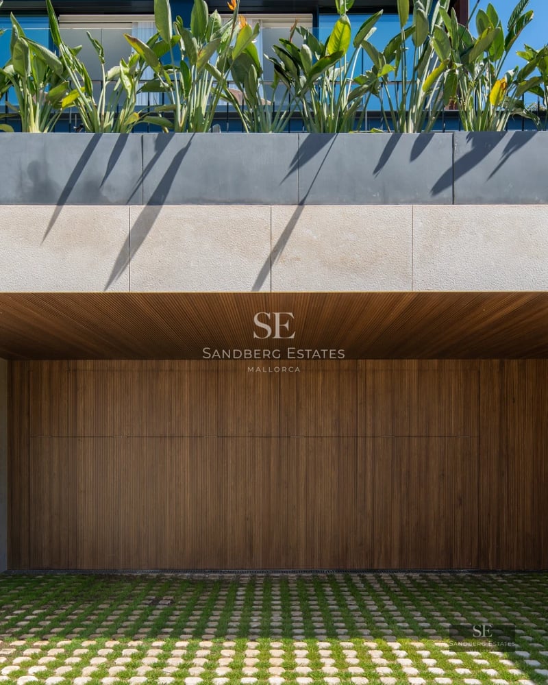 Spacious living room featuring a modern fireplace, natural light and large windows. Contemporary and elegant design.