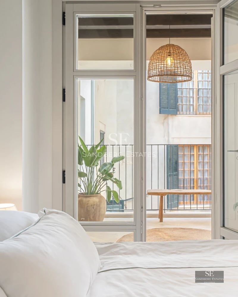 Modern villa exterior with reflecting pool, large windows, and minimalist landscaping. Warm lighting and contemporary architecture.